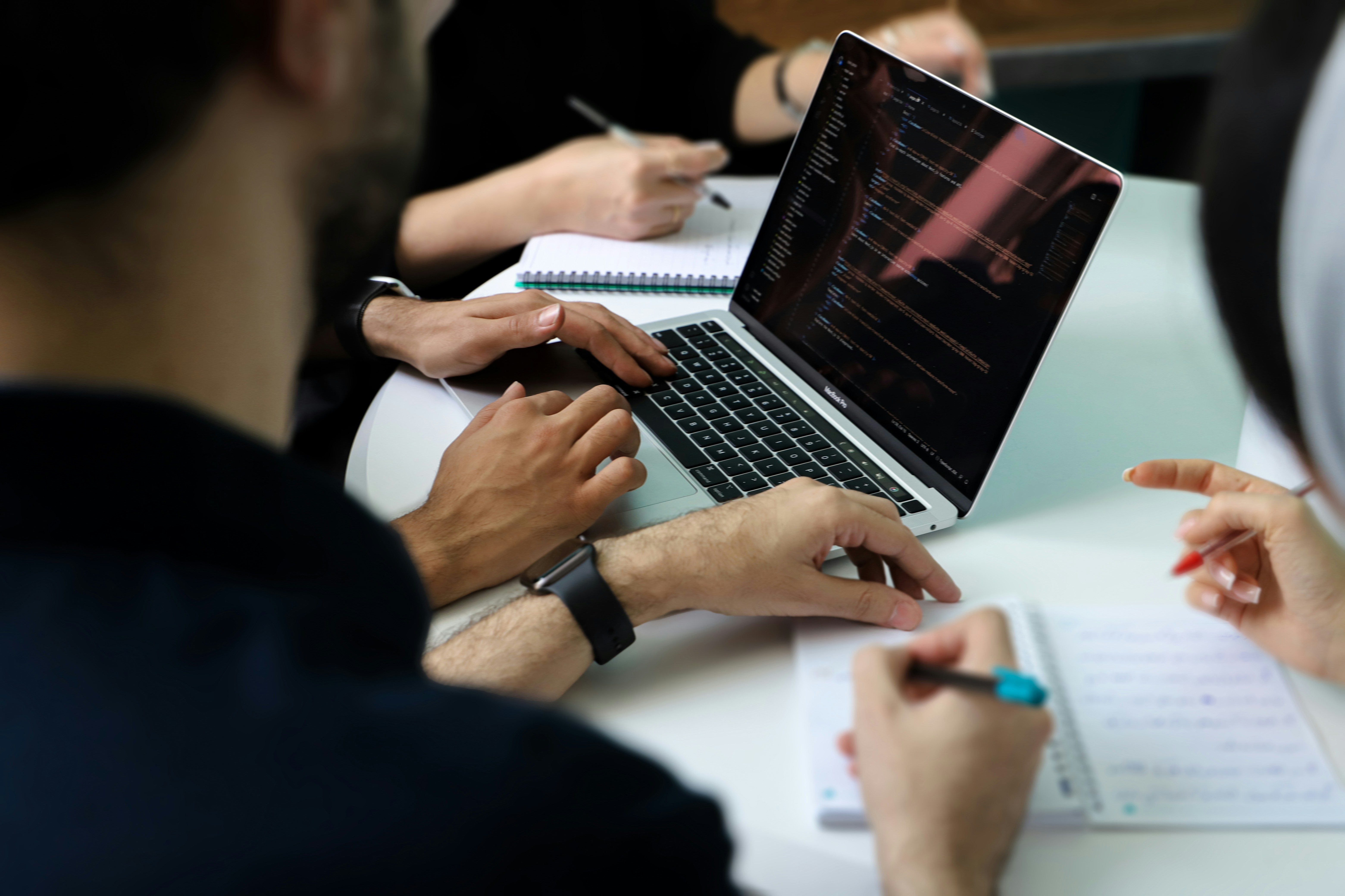 image of a diverse group of professionals in a meeting room for a digital marketing & advertising agency